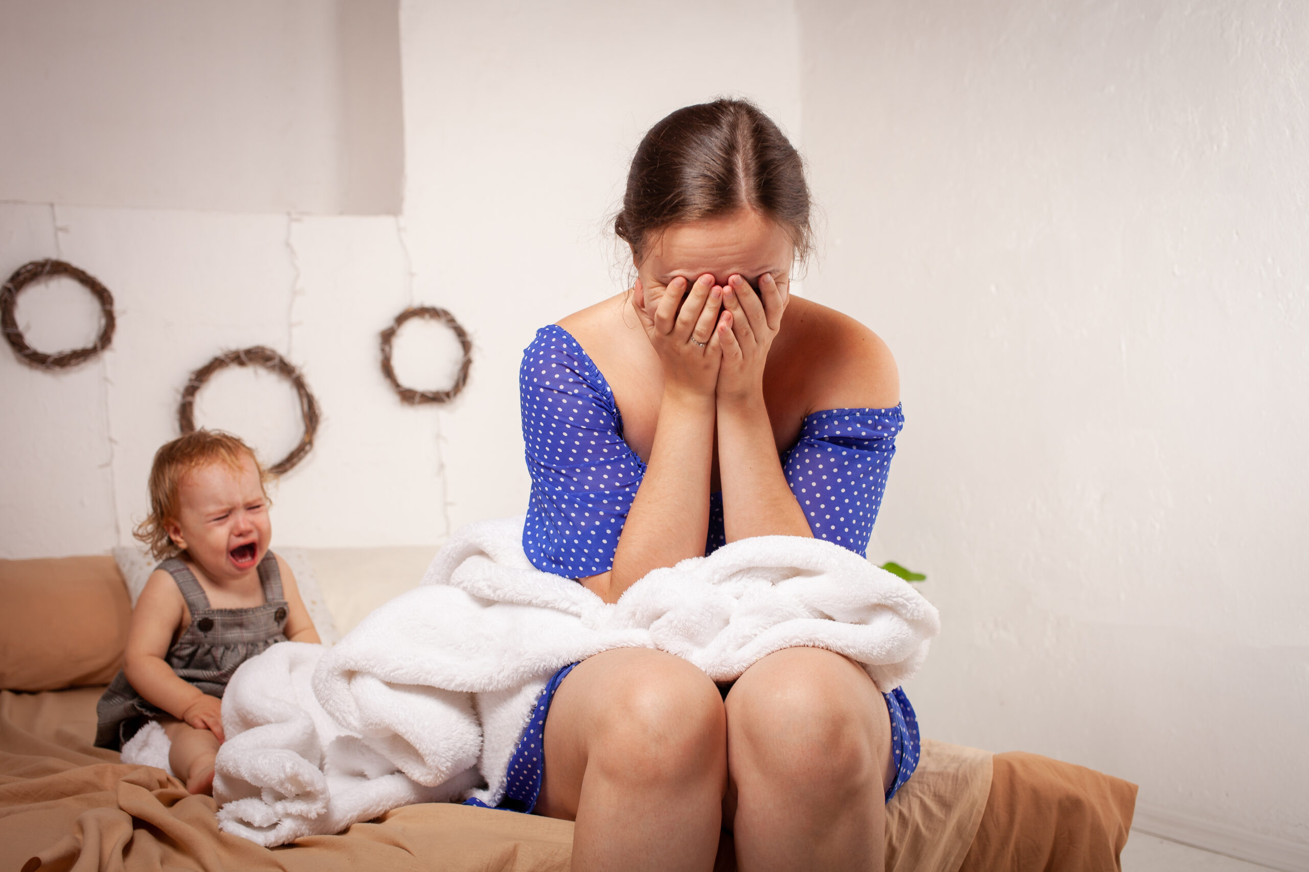 Mom is tired of the baby, wants to rest and sleep. The child screams, hysterical. The woman is tired of the child's cry, she does not want to hear it. A one-year-old girl yells from a toothache.